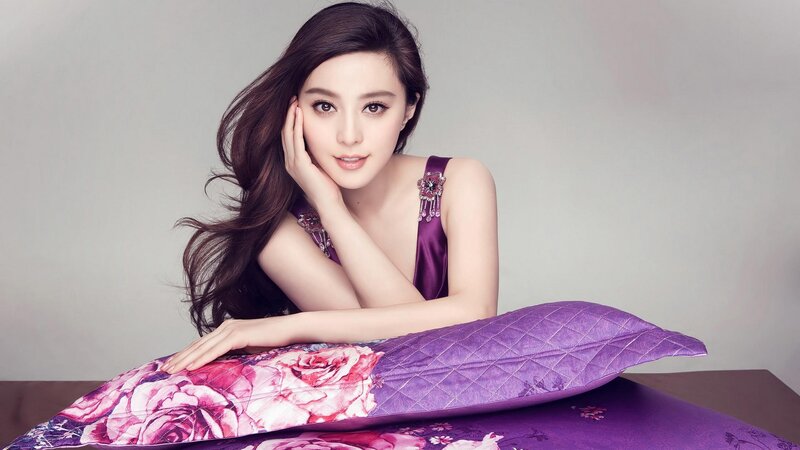woman in purple dress on pillow