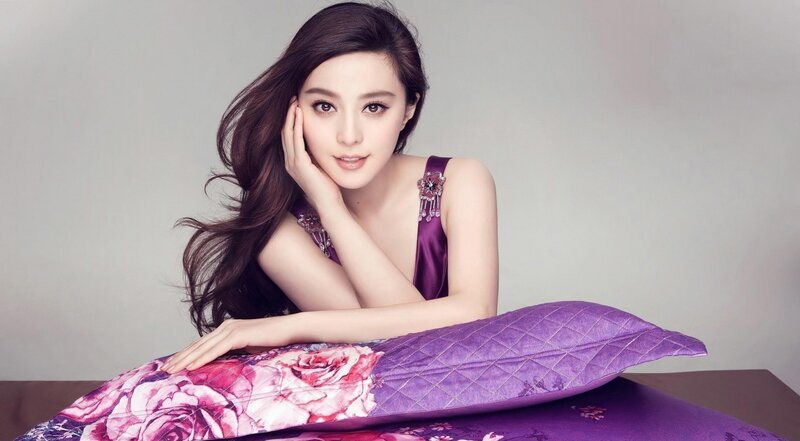 woman in purple dress on pillow