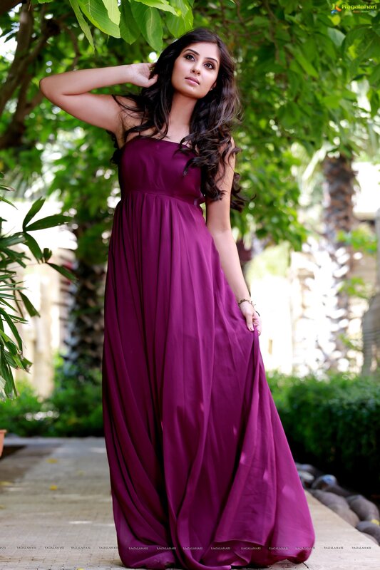 Woman in purple dress outdoors