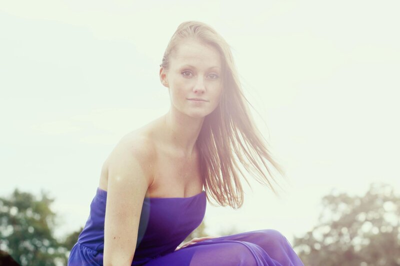 woman in purple dress outdoors