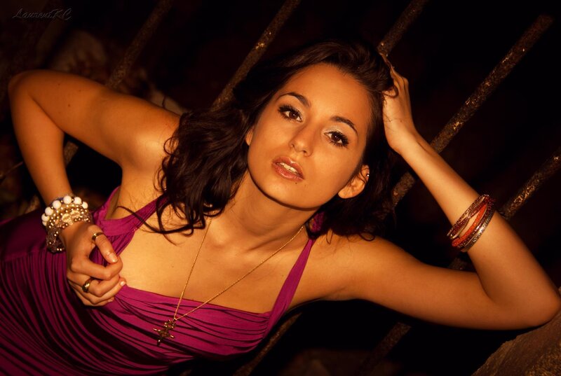 woman in purple dress posing
