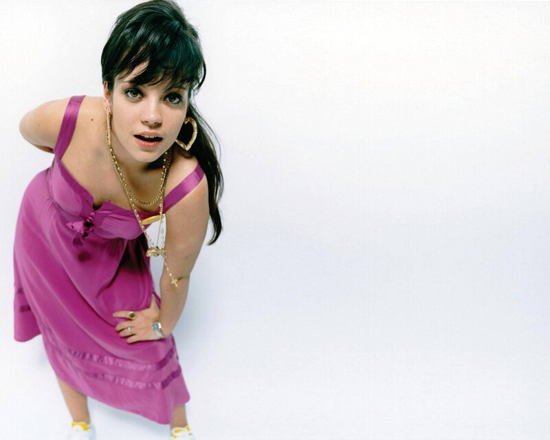 woman in purple dress posing