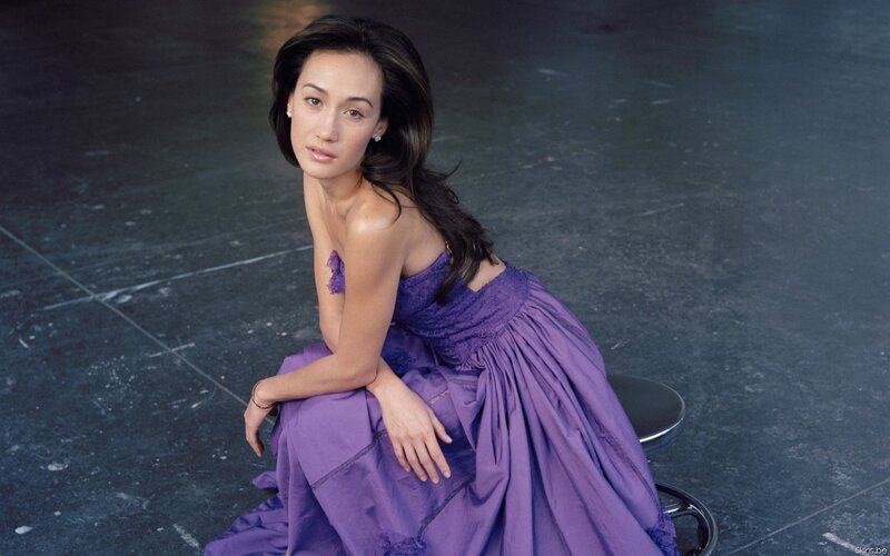 woman in purple dress sitting