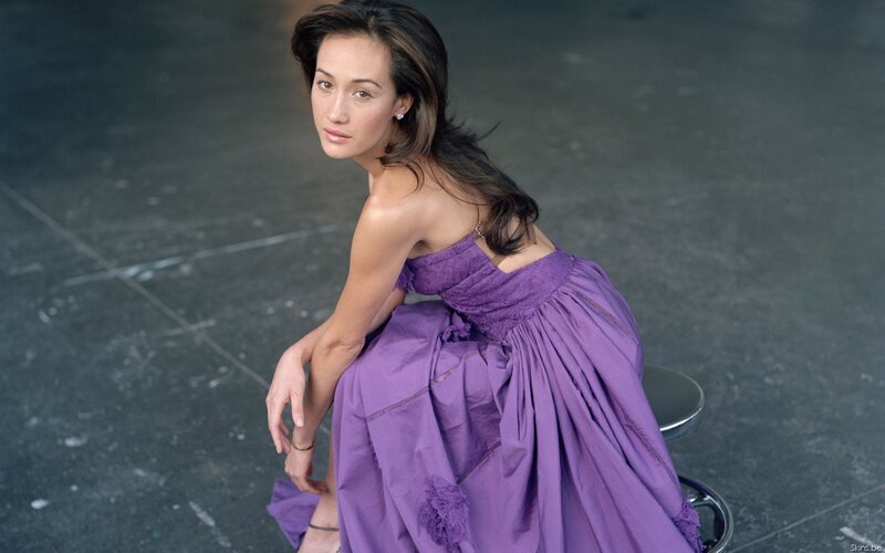 woman in purple dress sitting