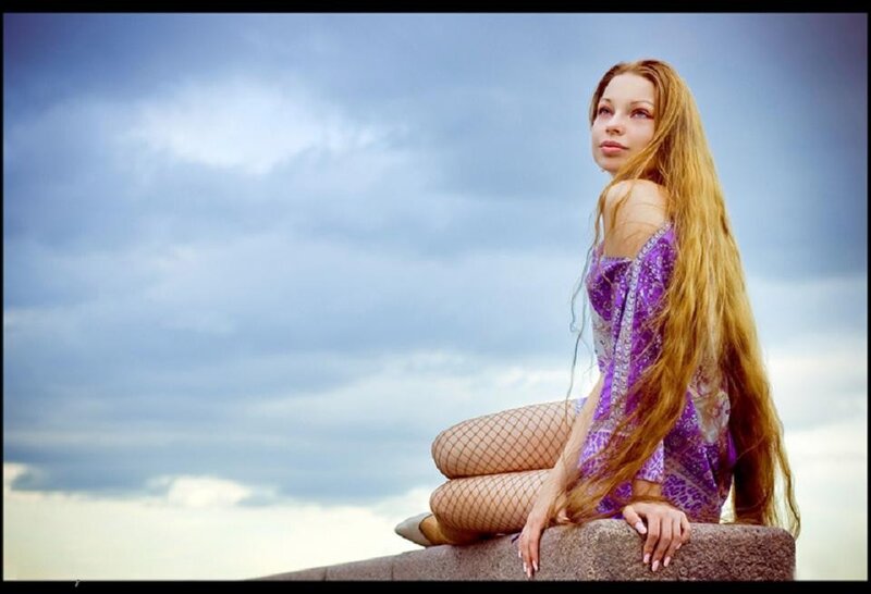 woman in purple dress sitting