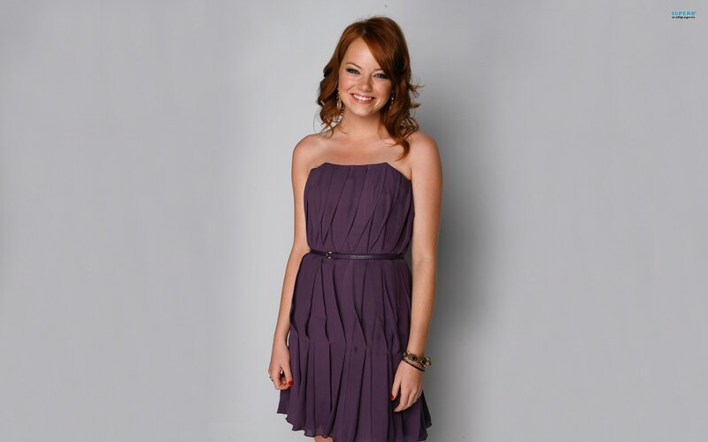 woman in purple dress smiling
