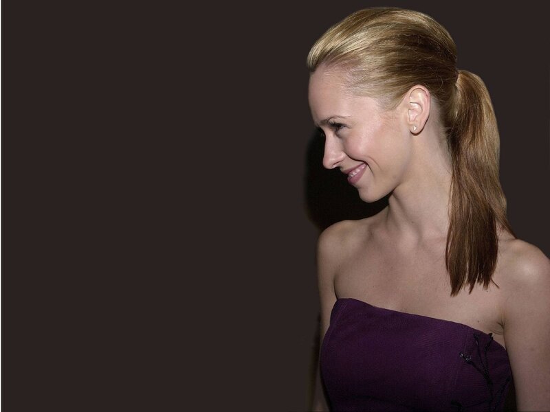 woman in purple dress smiling