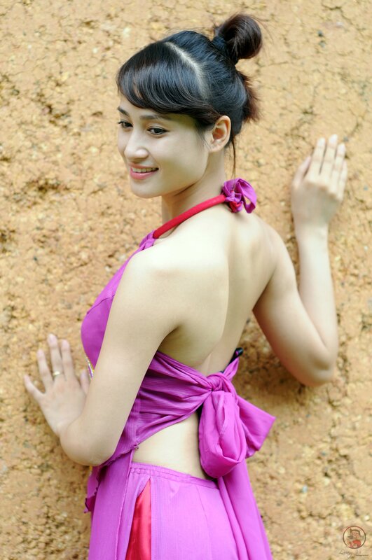 woman in purple dress smiling