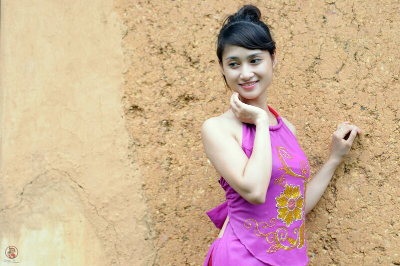 woman in purple dress smiling