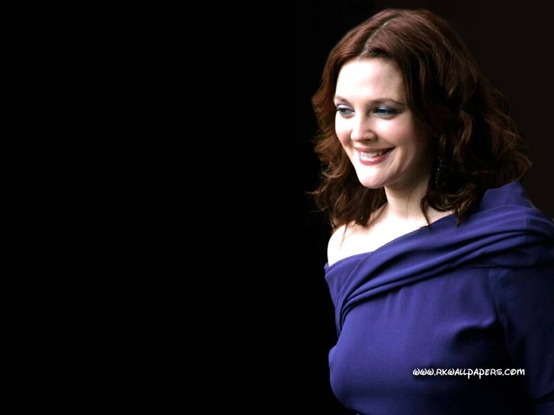 woman in purple dress smiling
