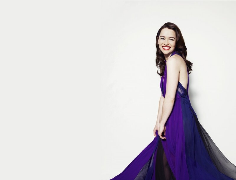 woman in purple dress smiling