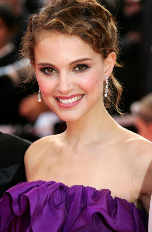 woman in purple dress smiling