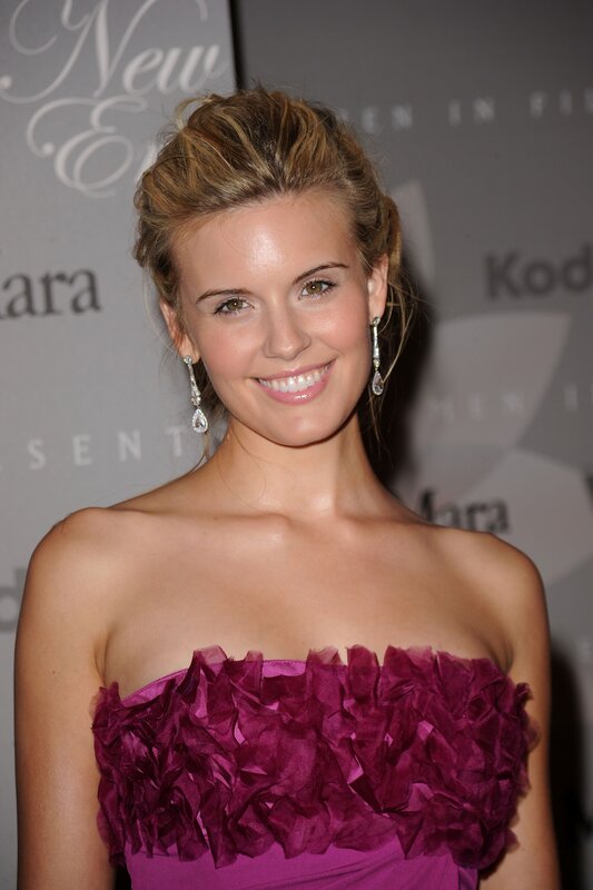 woman in purple dress smiling