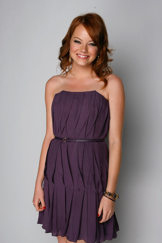 Woman in purple dress smiling