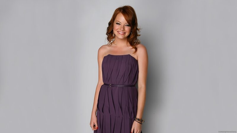 woman in purple dress smiling
