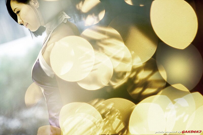 woman in purple dress with bokeh lights
