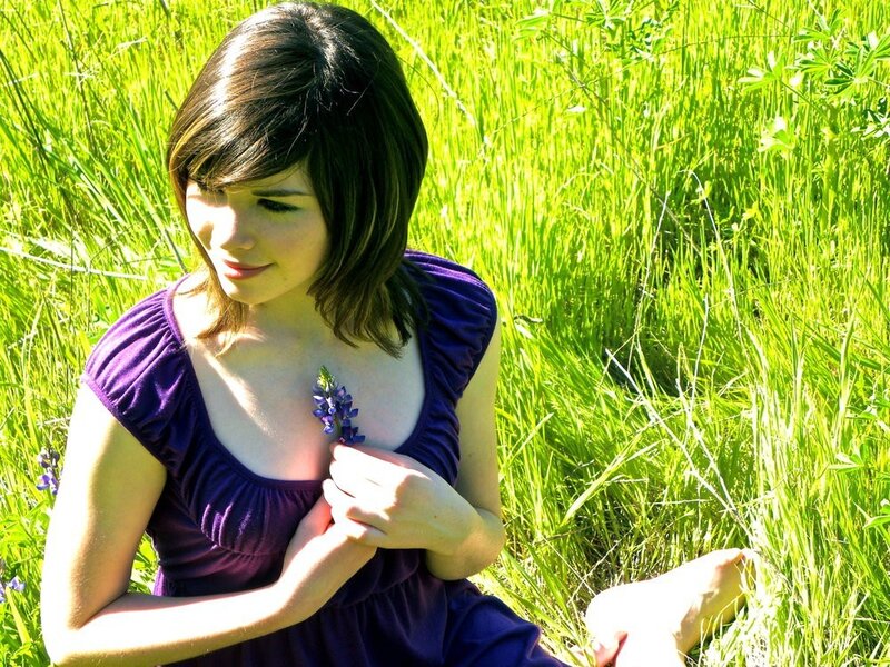 woman in purple dress with flower