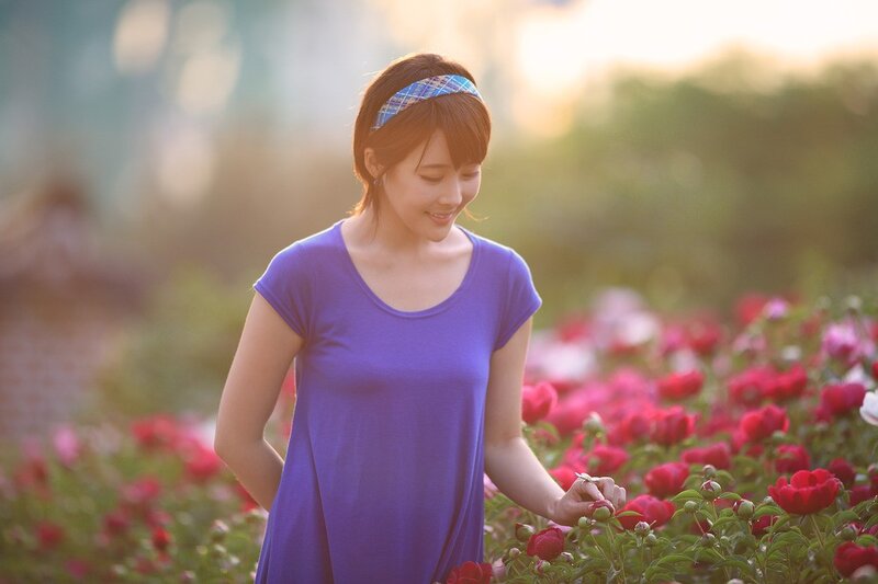 Woman in purple dress with flowers