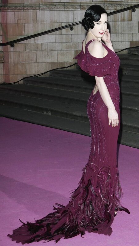 Woman in purple feather gown