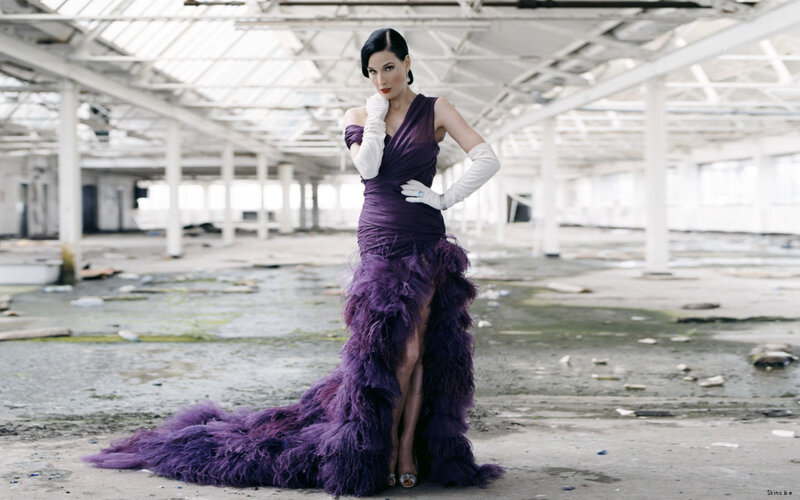 Woman in purple feather gown