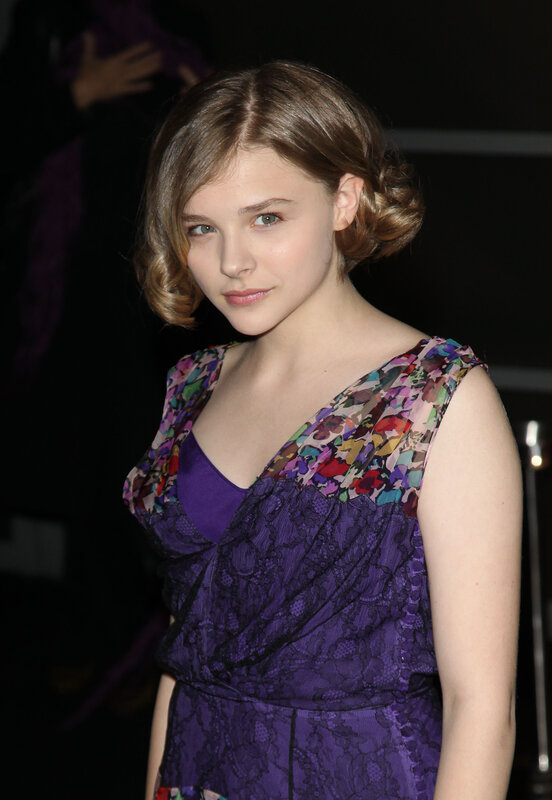 woman in purple floral dress