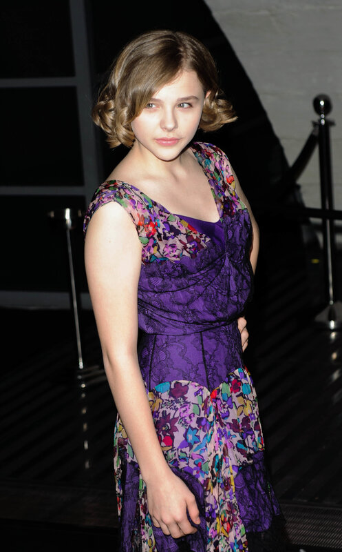 woman in purple floral dress