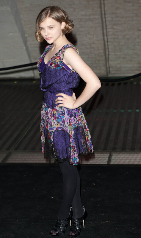 woman in purple floral dress