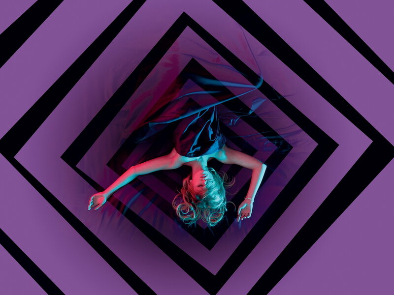 woman in purple geometric tunnel