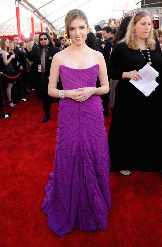 woman in purple gown on red carpet