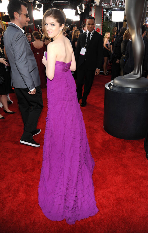 woman in purple gown on red carpet