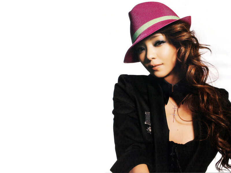 woman in purple hat and black jacket