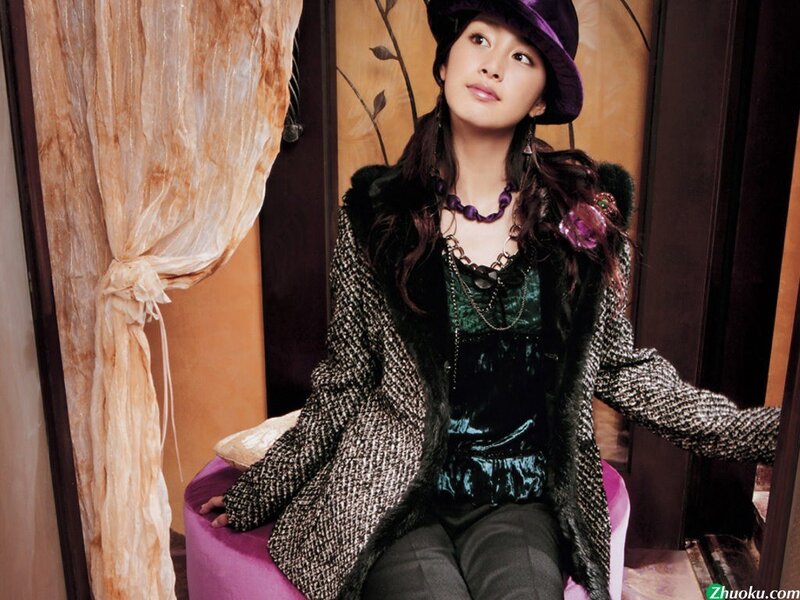woman in purple hat and coat