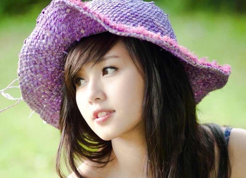 woman in purple hat outdoors