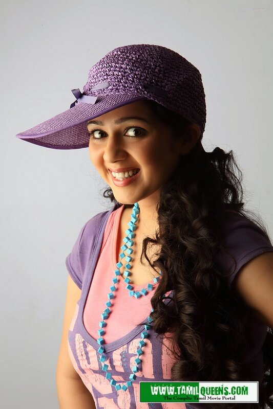 woman in purple hat smiling