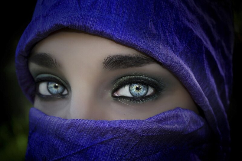 woman in purple headscarf