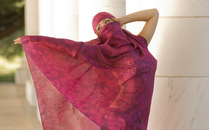 woman in purple headscarf