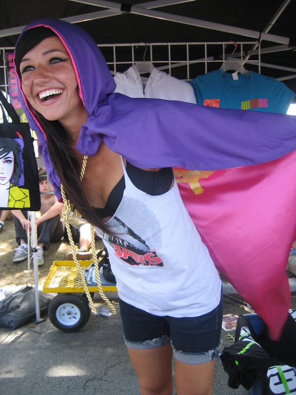 Woman in purple hooded cape