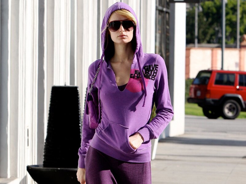 Woman in purple hoodie walking