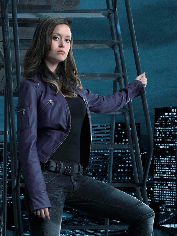 woman in purple jacket on ladder