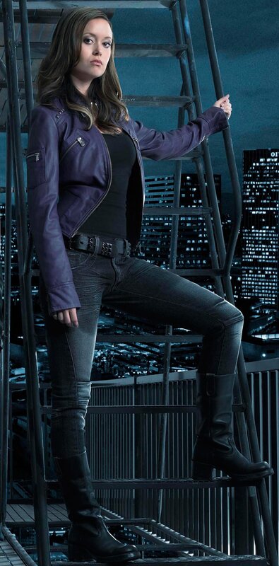woman in purple jacket on ladder