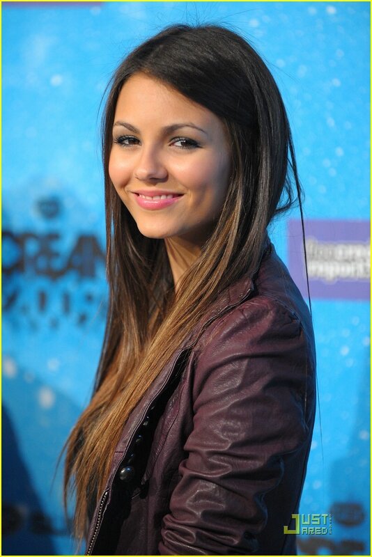 woman in purple jacket smiling