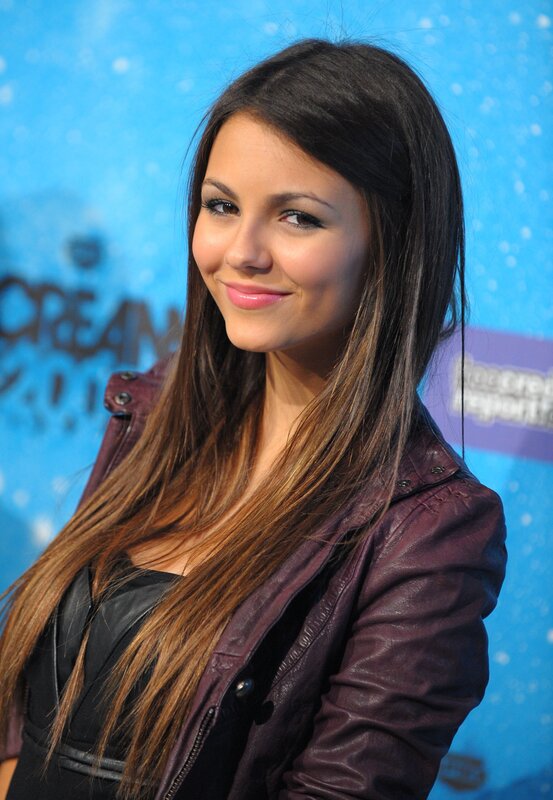 woman in purple jacket smiling