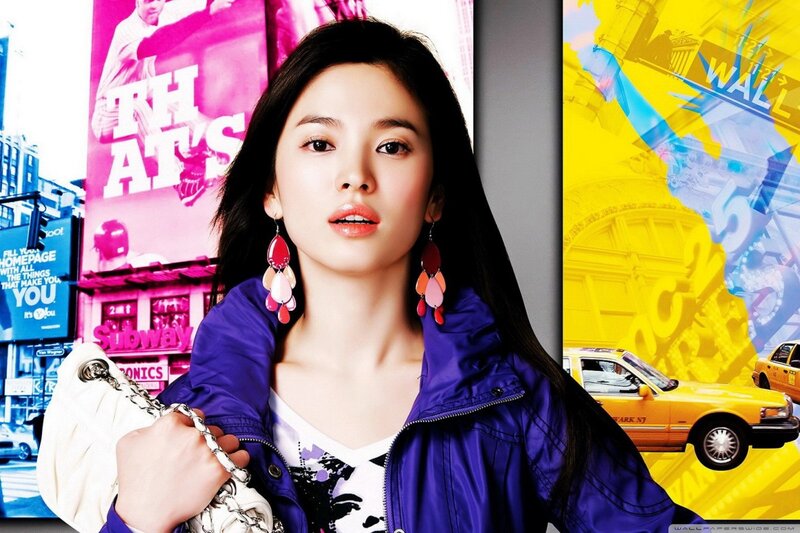 woman in purple jacket with city backdrop