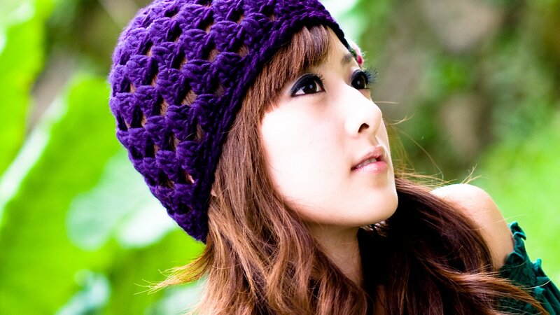 woman in purple knit hat