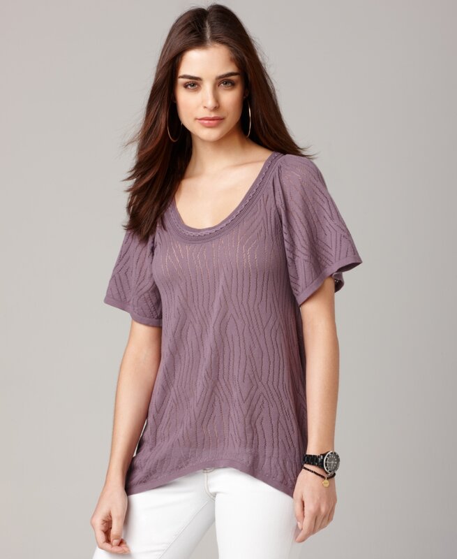 woman in purple knit top