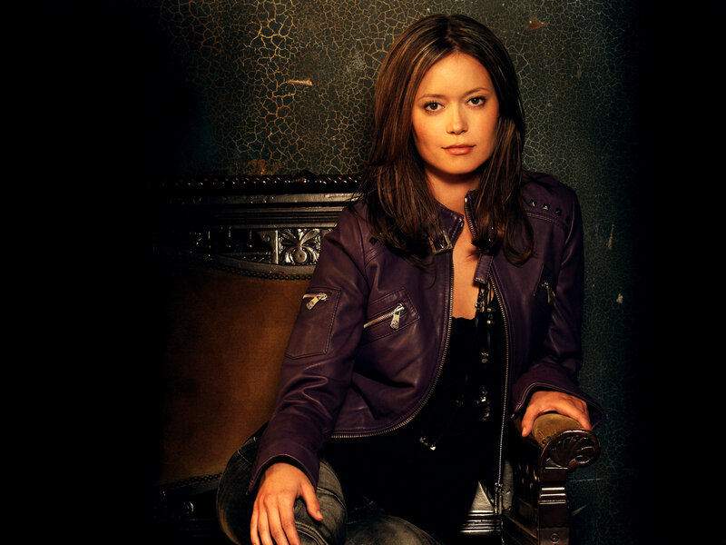 woman in purple leather jacket