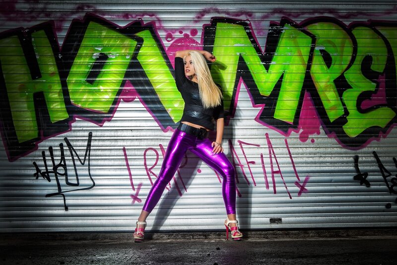 woman in purple leggings posing