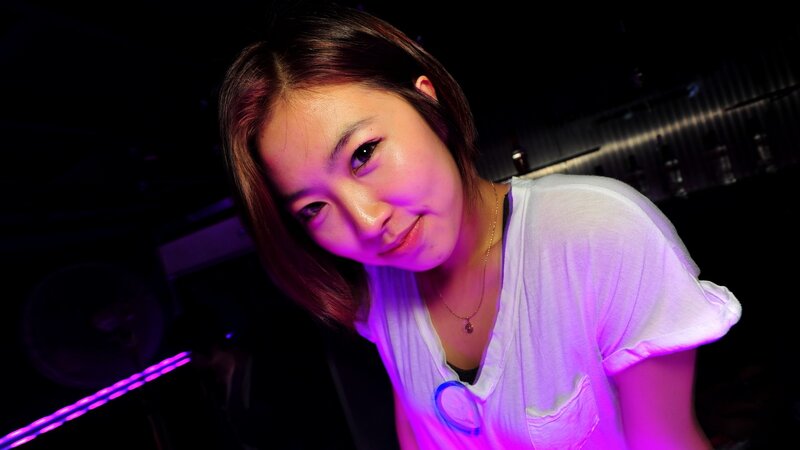woman in purple light at night