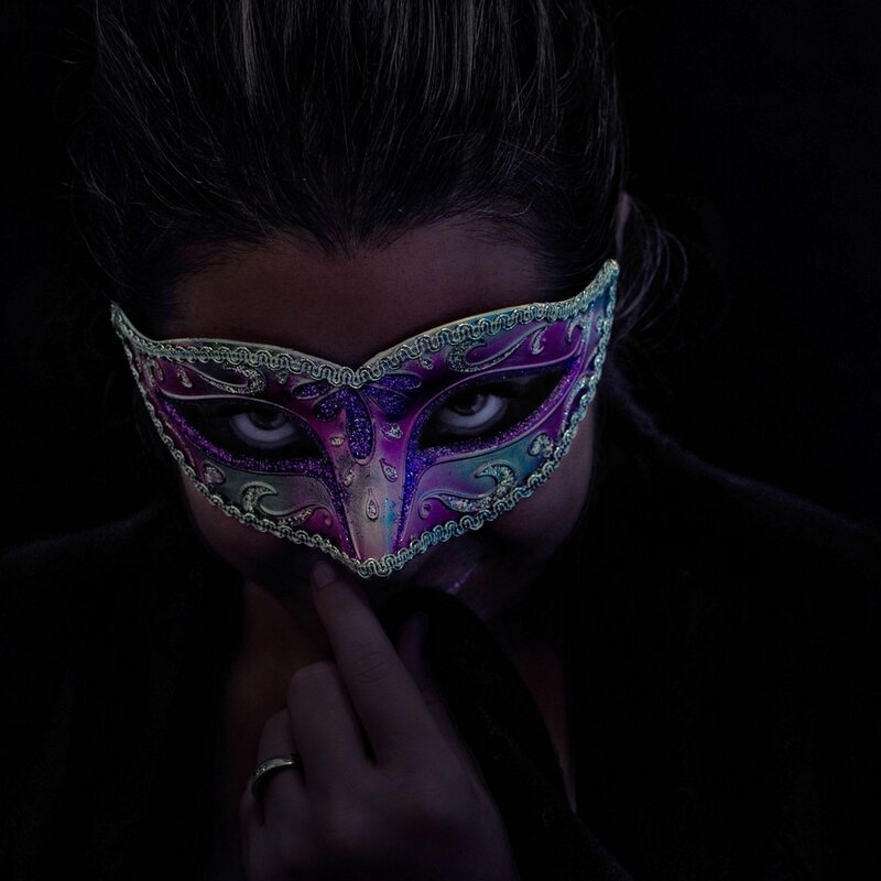 woman in purple mask