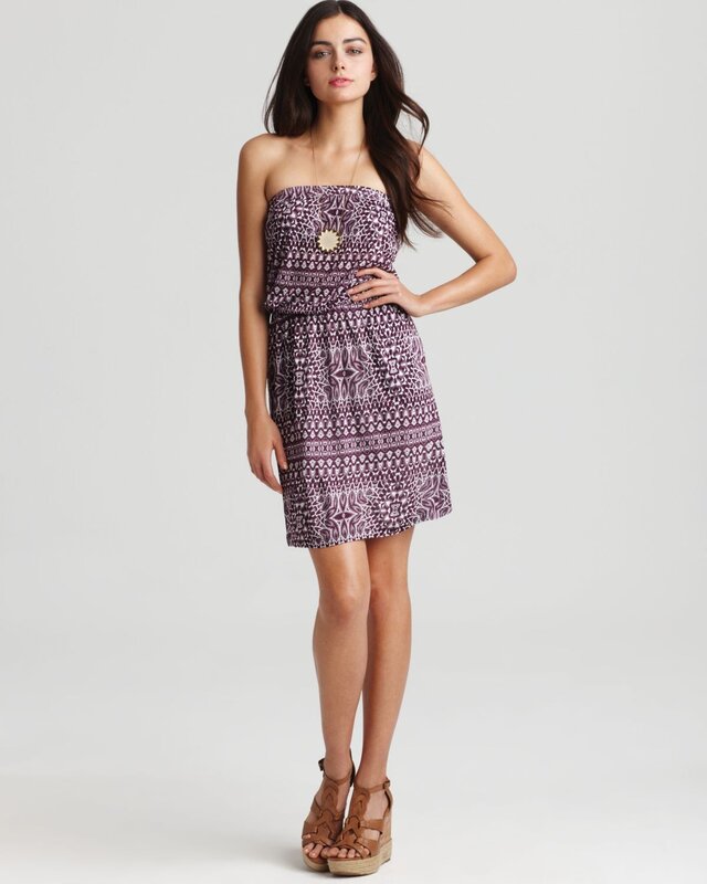 woman in purple patterned dress